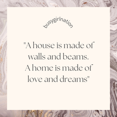 Marble background with the quote: A condo is made of walls and beams. A home is made of love and dreams, with busygirlnation above it.